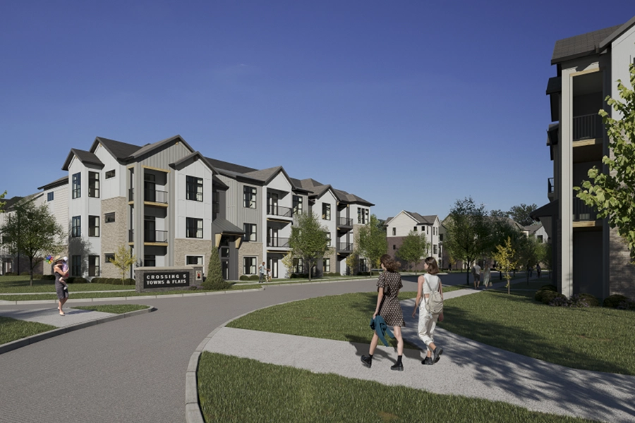 Two women walking through an apartment community